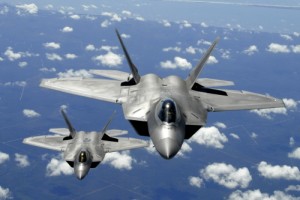 Two F-22 Raptors from Tyndall Air Force Base, Fla., fly in formation. Its combination of stealth, supercruise, maneuverability, and integrated avionics, coupled with improved supportability, represents an exponential leap in warfighting capabilities. The F-22 performs both air-to-air and air-to-ground missions allowing full realization of operational concepts vital to the 21st century Air Force. (U.S. Air Force photo/Senior Master Sgt. Thomas Meneguin)